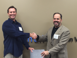Sean Kinghorn (left), Senior Sustainability Program Manager at Intuit, accepts award from SR Inc’s CEO Jim Boyle (right) on behalf of Intuit.
